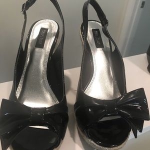 Wedge heels with patent leather uppers. Lightly worn.
